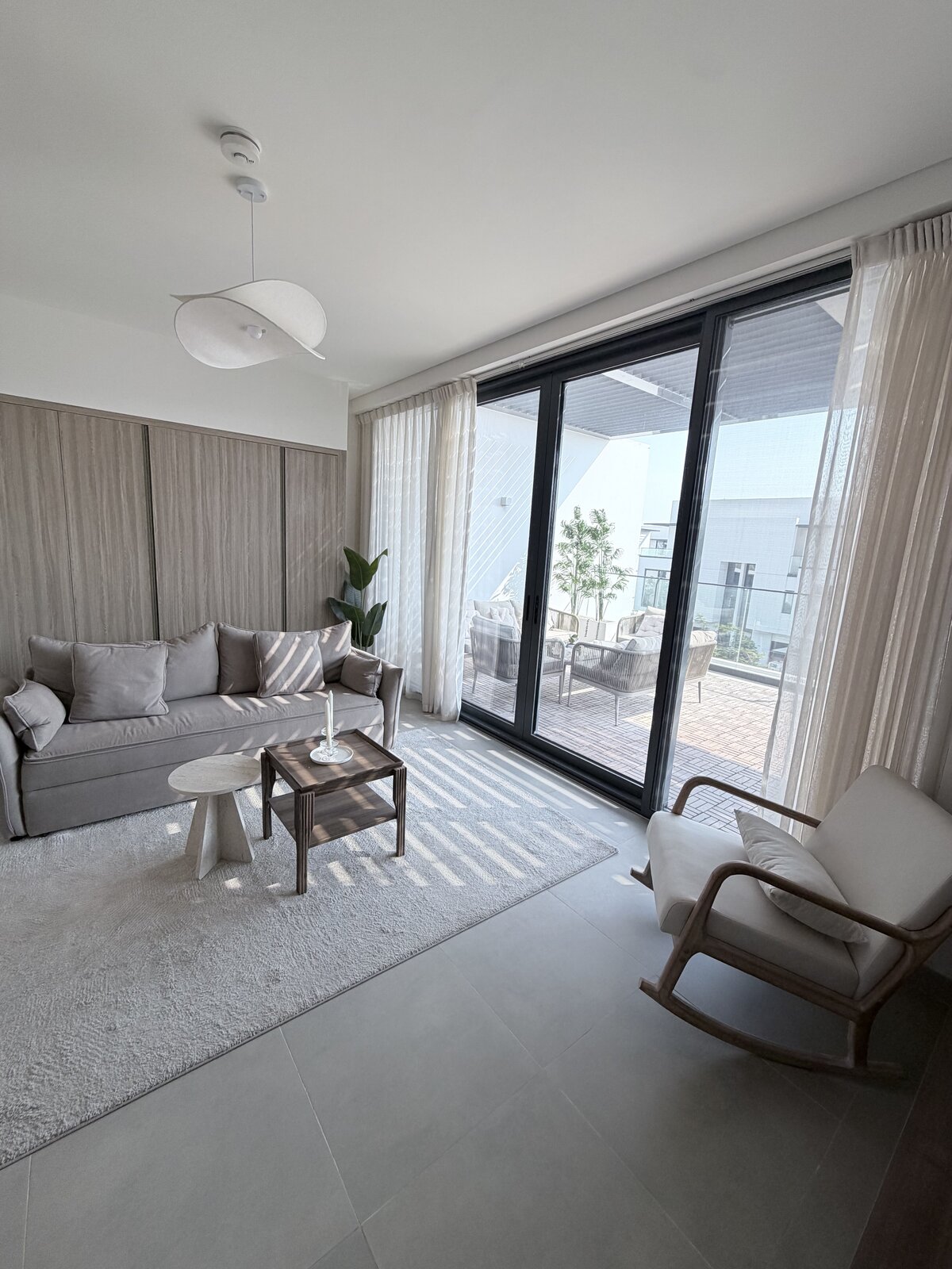 Palm Jumeirah townhouse second living room after renovation, furnished with terrace access